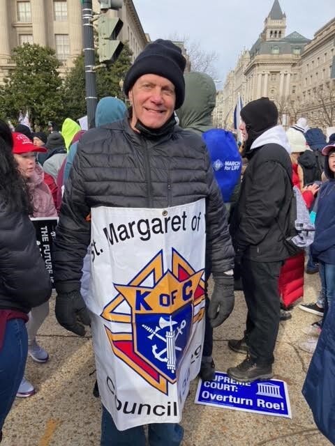 knight at march for life with sign